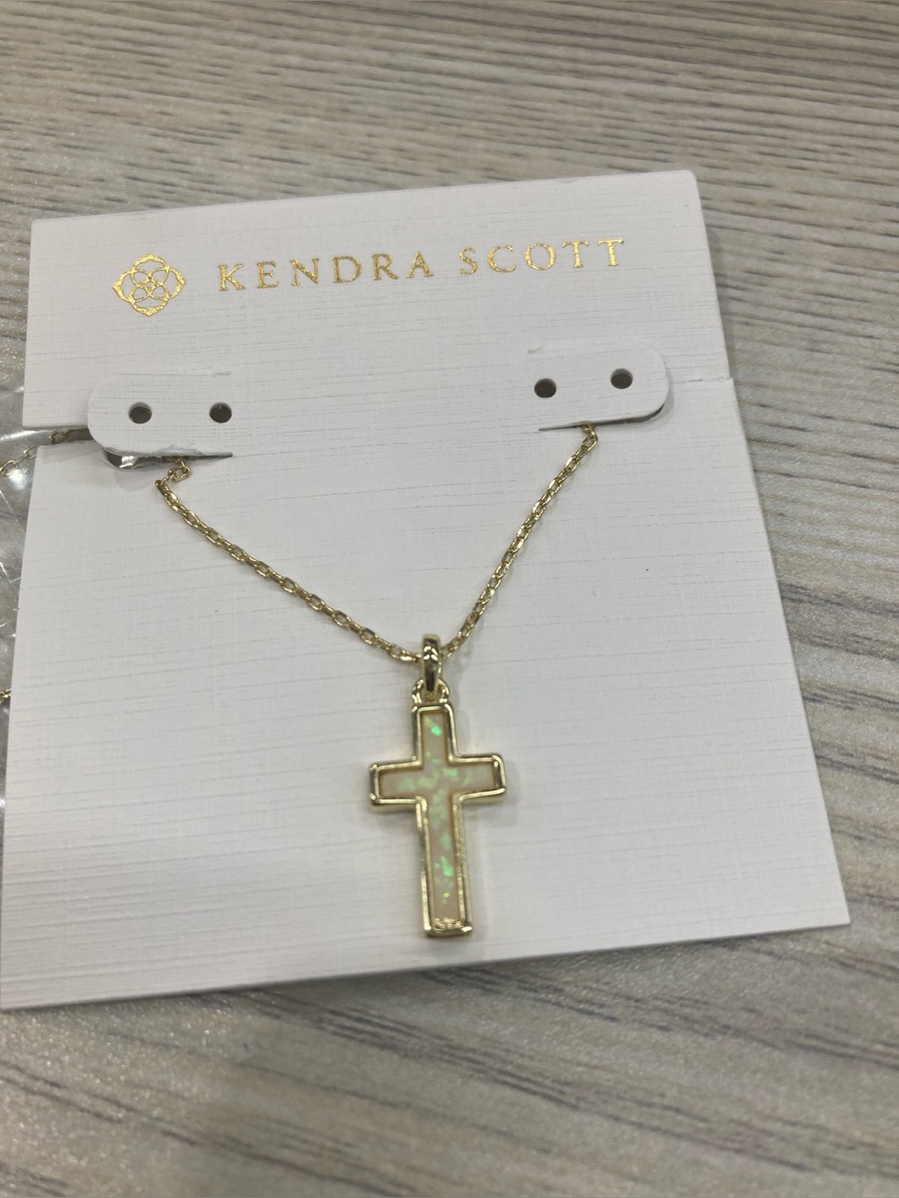 Kendra Scott Gold Cross Necklace with Iridescent White Opal Inlay